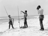 Woman and Two Men All Are Wearing Surf Fishing Gear