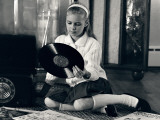 Teen Girl With Vinyl Records and Record Player  Sitting on Floor