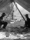 Three Men at Primitive Campsite  Twp Men Sitting in Tent  One Sitting By Campfire