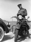 Policeman on a Motorcycle Writing a Ticket