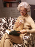 Woman Reading Book  Holding Orange Tabby Cat