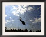 A US Navy Hh-60 Seahawk Stirs Up Debris While Taking Off