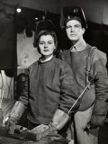 Couple in Ww Ii Defense Plant With Welding Gear