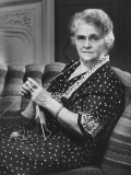 Mature Woman Knitting in Living Room