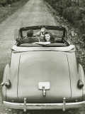 Couple Riding in Vintage Convertible Car  Elevated View