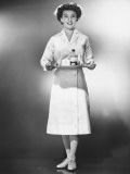 Nurse Holding Medicines on Tray Posing in Studio