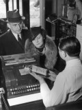 Couple Picking Up Prescription in Pharmacy