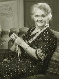 Senior Woman Knitting in Living Room  Portrait