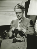 Mature Woman Knitting in Living Room