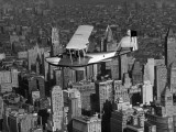 Coast Guard Flying a Plane Over Manhattan