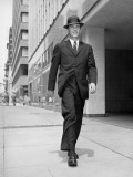 Man in Business Suit Strolling Outdoors