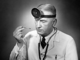 Doctor Reading Thermometer
