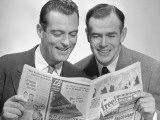 Two Businessmen Reading Newspaper