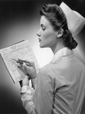 Nurse Reading Patient's Chart