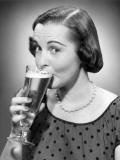 Woman Drinking a Glass of Beer