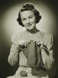 Young Woman Knitting in Studio  Portrait