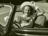 Woman at Wheel of Convertible