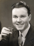 Man Holding Up Drink