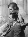 Couple Reading Newspaper