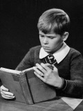 Young Boy Reading Book