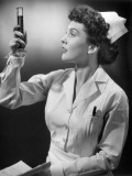 Nurse Looking at Test Tube