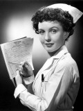 Nurse Filling Out Chart
