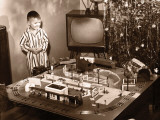 Boy (6-8) Looking at Model Train Set on Christmas Day