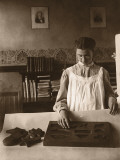 Girl (9-11) Doing Board Puzzle