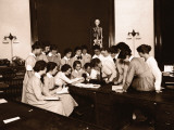 Female Nursing Students Watching Blood Pressure Demonstration