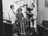 Optometrist Examining Woman's Eyes (B&W)