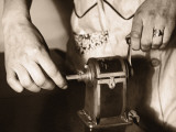 Woman's Hands Sharpening Pencil
