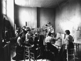 Young Women Sketching Naked Man in Art Class