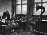 Boys (10-12) Studying in Music Class With Teacher