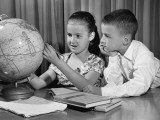 Boy and Girl Looking at Globe