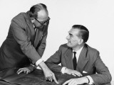 Two Men  One Pointing To Blueprint