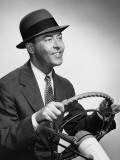 Man Gripping Steering Wheel