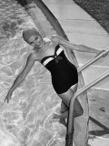 Woman in Swimming Pool Posing on Steps
