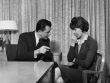 Man Pointing and Talking To Upset Woman