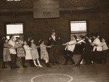 Girls Having Tug of War in Gym