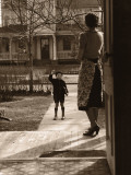 Mother on Porch Seeing Son Off To School  Rear View