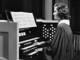 Woman Playing Organ in Church
