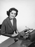 Woman Typing  Posing and Smiling