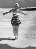 Woman Standing in Shallow Water at Ocean