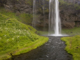 People on Trail Behind Seljalandsfoss Waterfall  Iceland