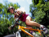 Young Female Recreational Mountain Biker Riding in the Forest