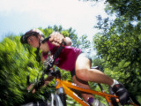 Young Female Recreational Mountain Biker Riding in the Forest