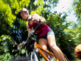 Young Female Recreational Mountain Biker Riding in the Forest