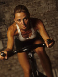 Young Woman Exercising on a Stationary Bike