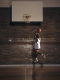 Young Boy Practicing his Basketball Shooting