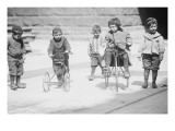 Children With Tricycles Playing In Manhattan Street